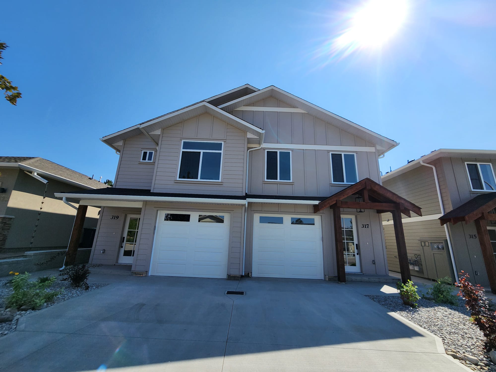 Residential garage door installation in Kelowna - white panel doors
